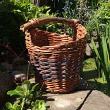Asymmetrical basket with wooden handle