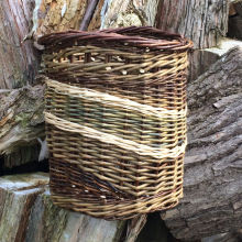 Medium sized log basket with neat finger carrying holes. 35cm H x 32cm W.